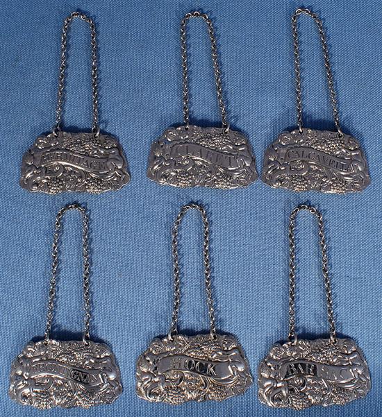 A rare set of six Irish George III silver wine labels, by John Townsend?, Width of each 60mm Total weight: 2.1oz/68grms